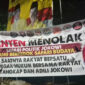  Sejumlah spanduk berisi penolakan terhadap rencana kedatangan mantan Presiden Jokowi terpasang di sejumlah titik di Kabupaten Tangerang, Banten (CNN Indonesia)

