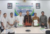Sekda Tojo Una-Una Alfian Matajeng bersama jajaran Pemkab Touna dan BPJS Ketenaga kerjaan saat pembahasan dan penandatanga nan kerja sama di Kantor Cabang BPJS Ketenaga kerjaan Sulawesi Tengah, Palu, Senin (28/9/2026) lalu. (ft: RadarPalu)