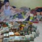 Pelaku pencurian berikut barang bukti puluhan kotak amal yang ditemukan di rumah pelaku.  ft:(Rumah Yatim Riau)